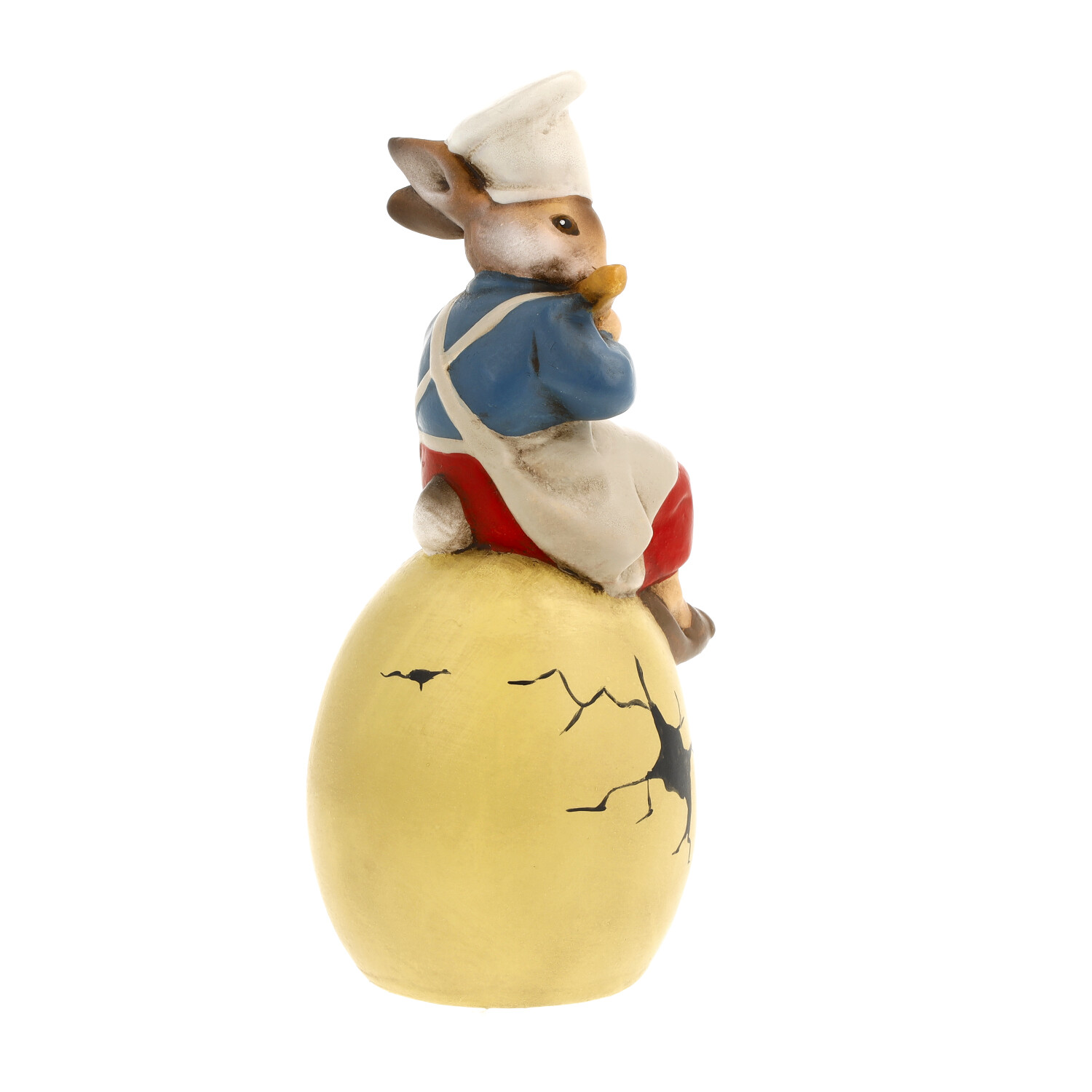 Osterhase Dekofigur als Koch auf rissigem gelbem Ei