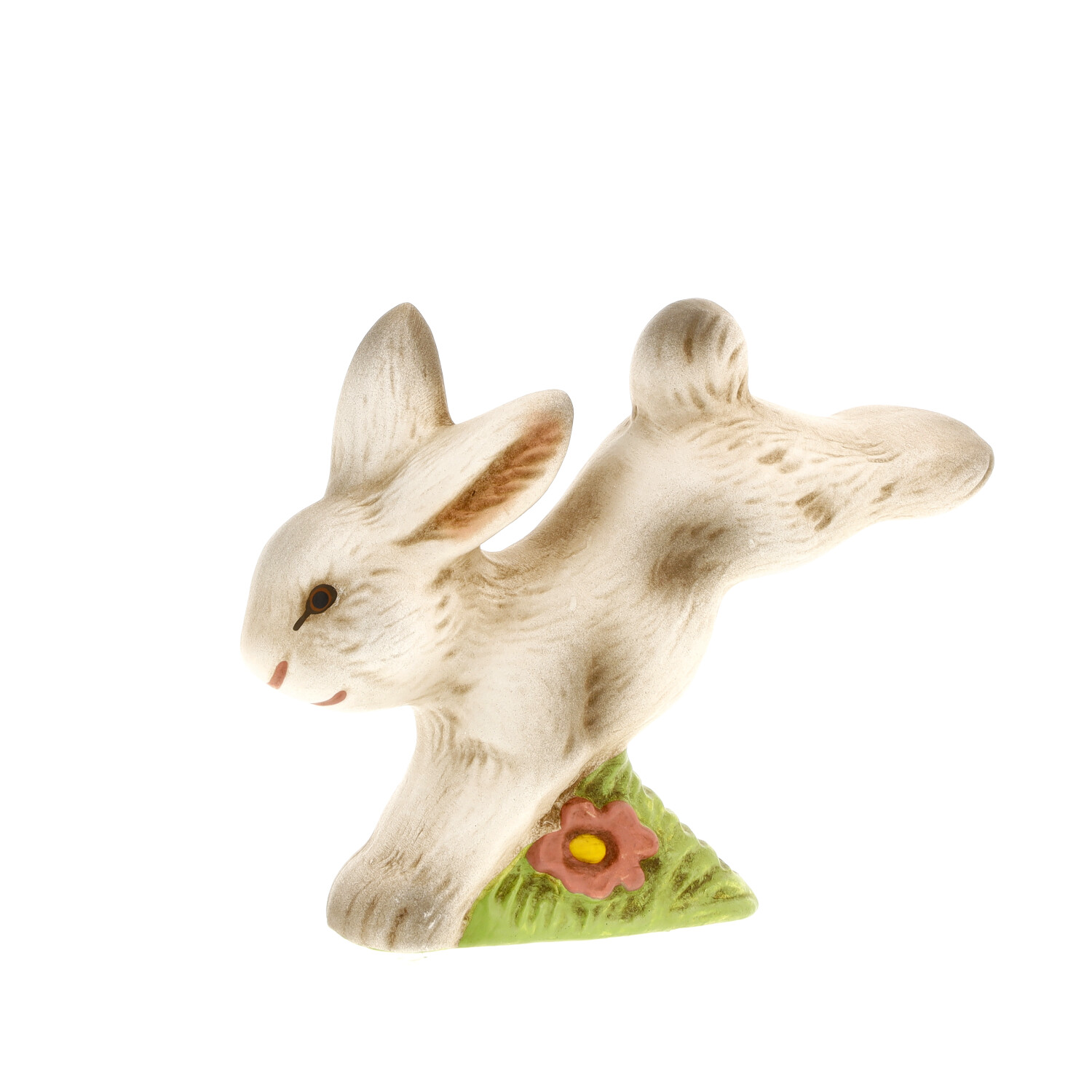 Springende Keramik-Hasenfigur auf grünem Sockel, Blume