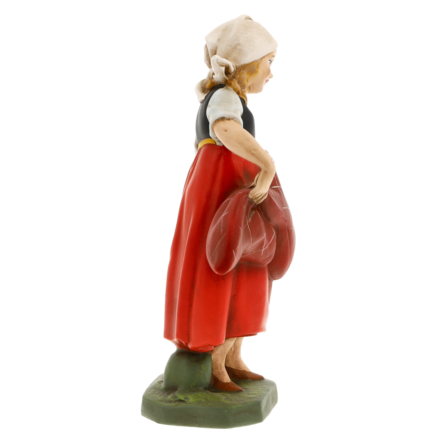 Mädchenfigur in Tracht, seitlich, hält Herz-Dekor
