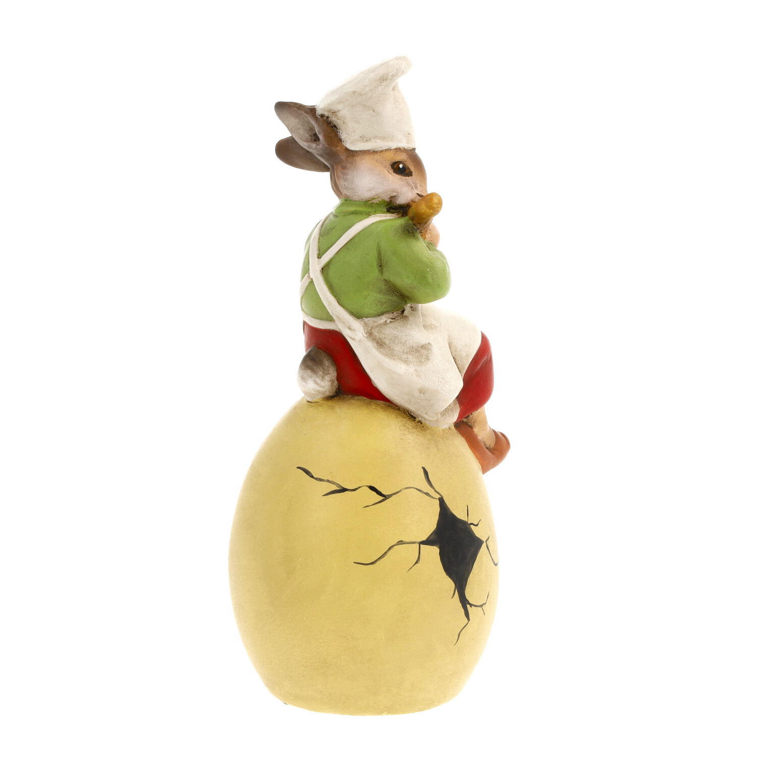 Hase mit Kochmütze sitzt auf gelbem, rissigem Ei