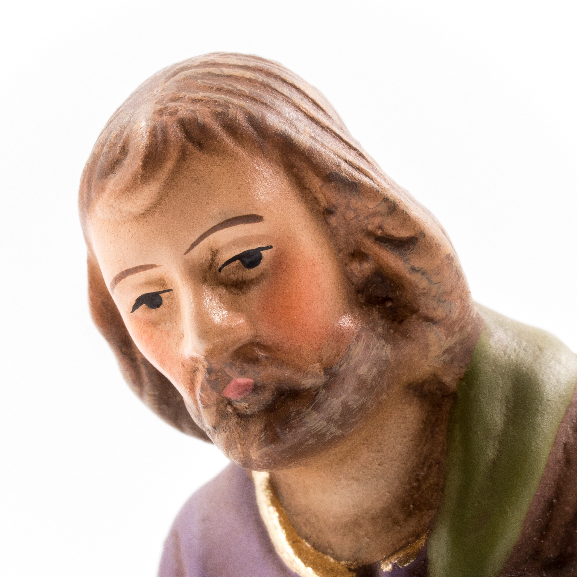 Nahaufnahme handbemalte Krippenfigur eines Mannes