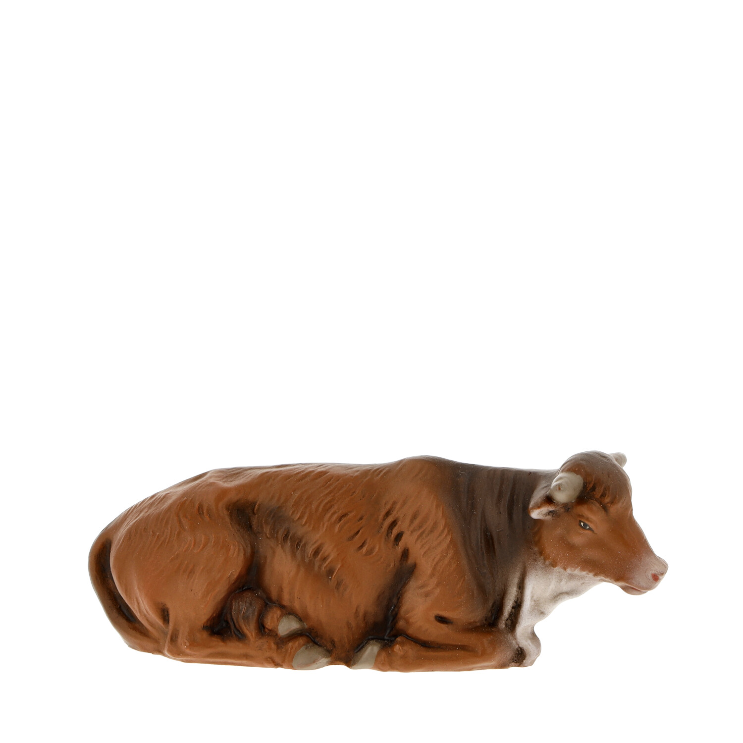 Braune liegende Kuh als Krippenfigur